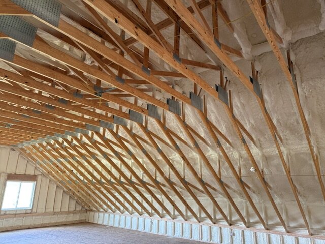 Roof truss framing with closed cell spray foam insulation Wichita KS