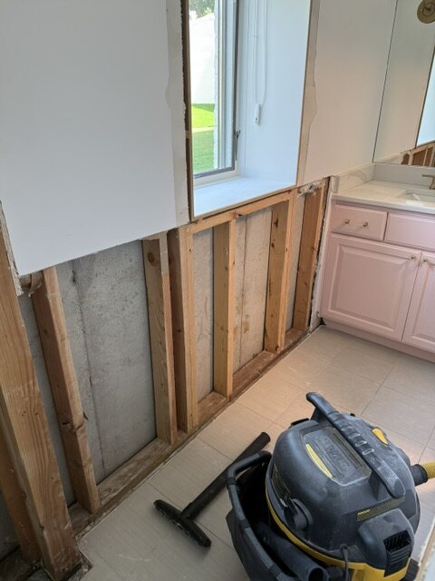 Bathroom remodel demolition with vanity and framing exposed Wichita KS