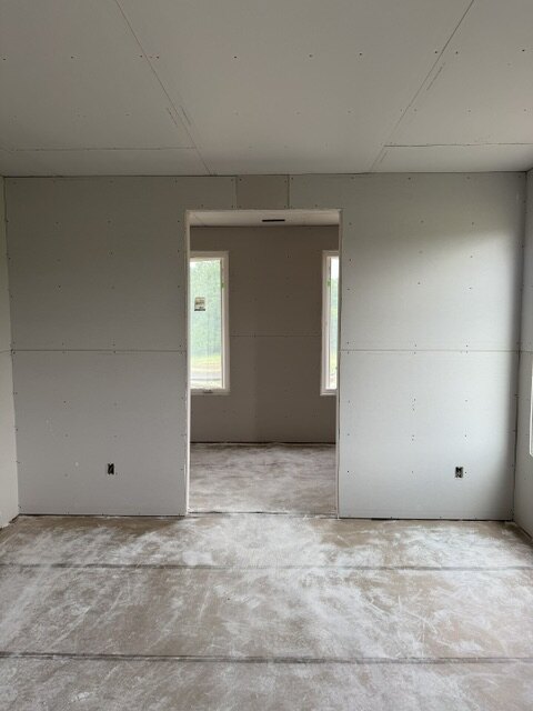 Finished drywall bedroom with doorway on a new construction home in Wichita KS
