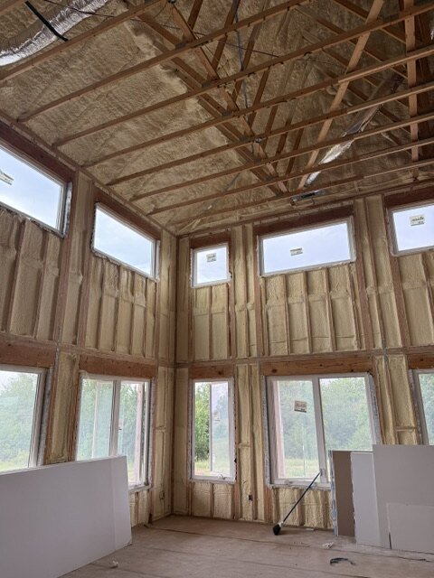 Vaulted great room framing with spray foam insulation and window wall in Wichita Kansas